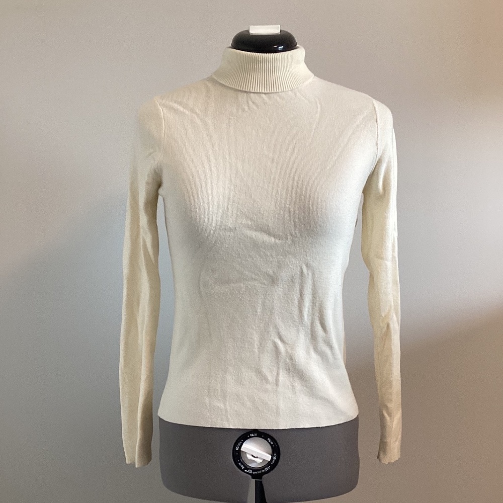 Cream coloured turtleneck sweater